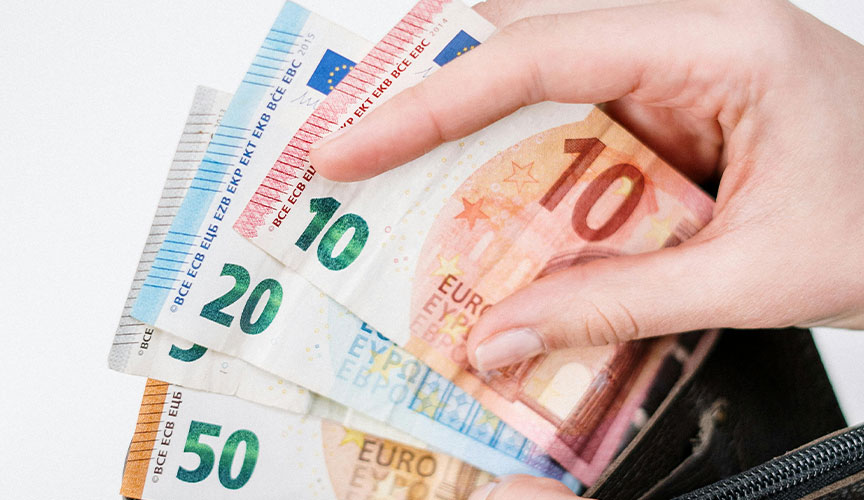 Photo of a wallet and some euros